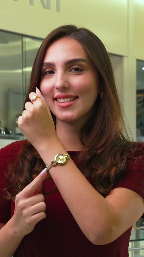 Trying on a watch, Khater